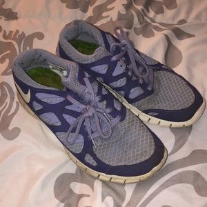Purple Nike running shoes